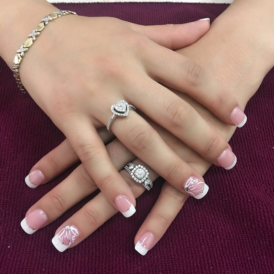 Rows of polish bottles beside pedicure chairs